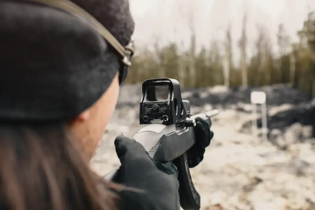 A Guy Shoots From a Hunting Rifle on the Shooting Range 