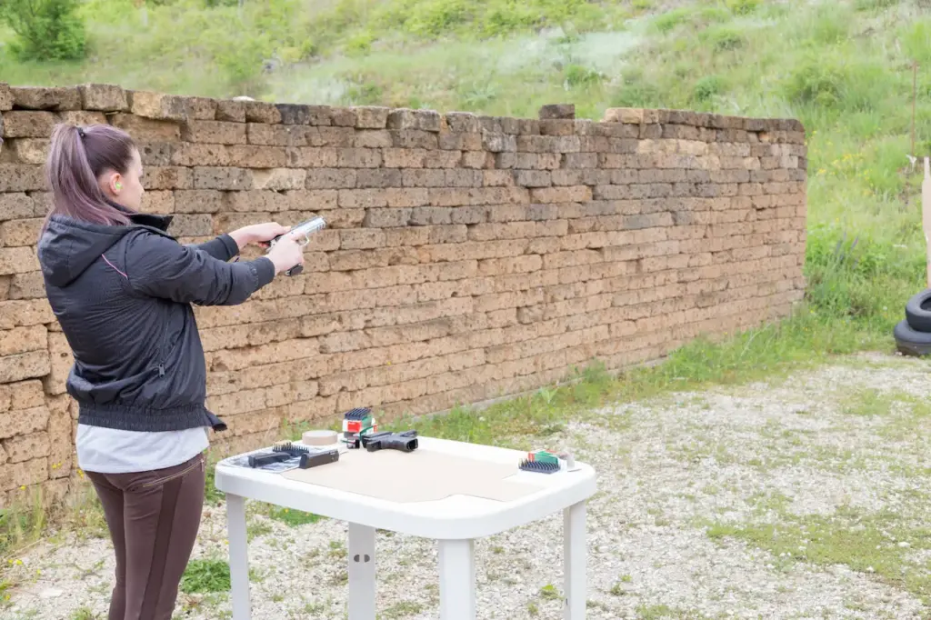 Girl Practicing at the Shooting Range 