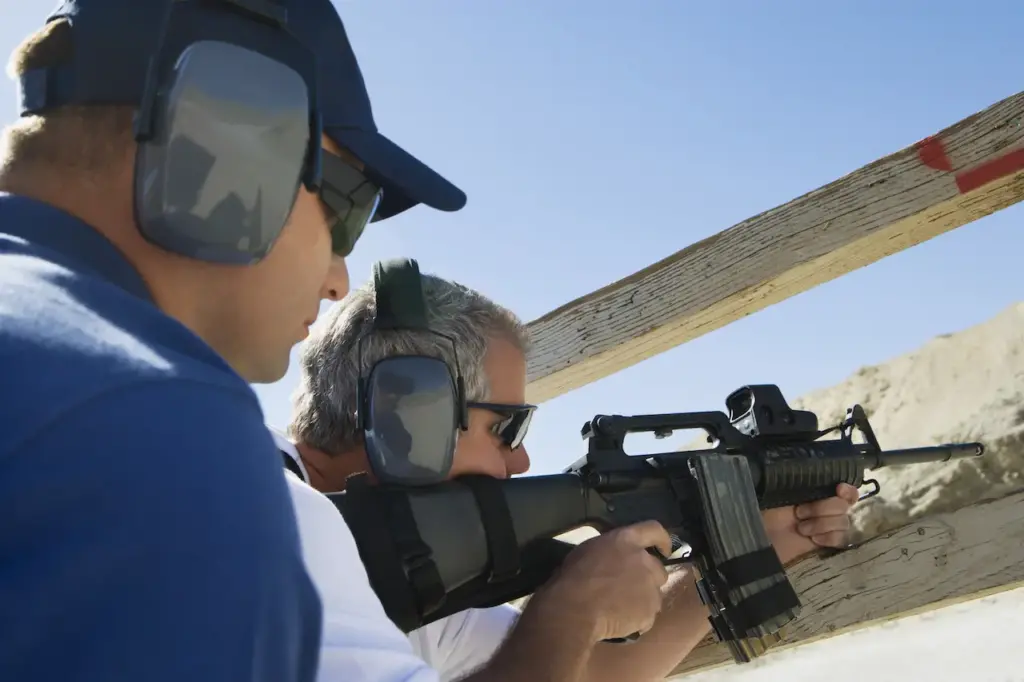 Instructor With Man Aiming Machine Gun 