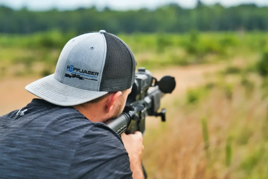 Man Firing A Sniper In A Shooting Ranges Area